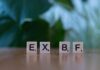 Effective Love Spells to Bring Back Your Ex Close-up of Scrabble tiles spelling 'EXBF' on a wooden table with blurred background. - love spells to bring back your ex