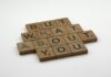 Make Him Think About You Constantly: The Ancient Mirror Technique That Never Fails Close-up of wooden Scrabble tiles spelling 'But What About You' on a white surface. - make him think about me constantly spell
